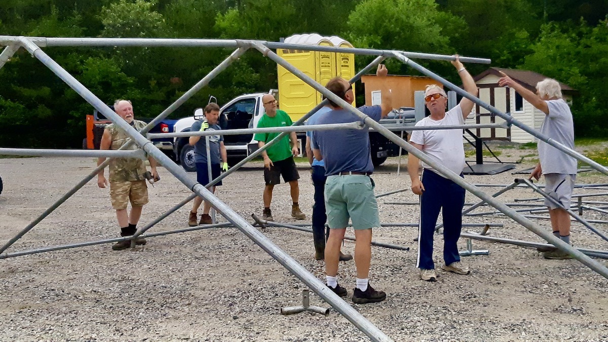 The team learned to assemble the new tents, which will provide for much larger audiences during community events and concerts.