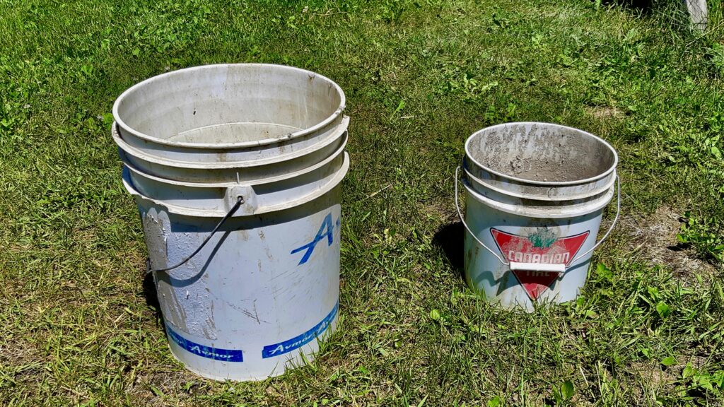These pails are used for "slaking"—the critical first step of dissolving bone-dry clay chunks in water. Large 5-gallon buckets provide the necessary volume for the clay to break down naturally and separate from the heavier rocks that sink to the bottom.