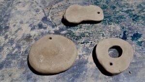 Test tiles made from locally collected clay in Melgund Township.