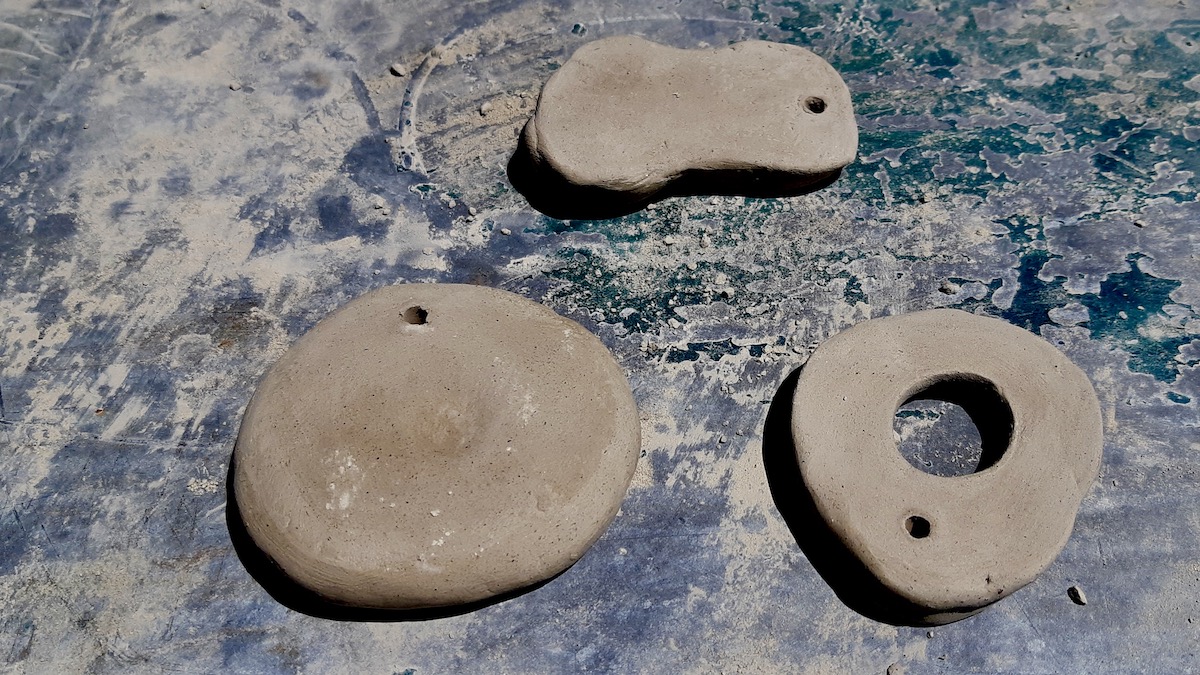 Test tiles made from locally collected clay in Melgund Township.