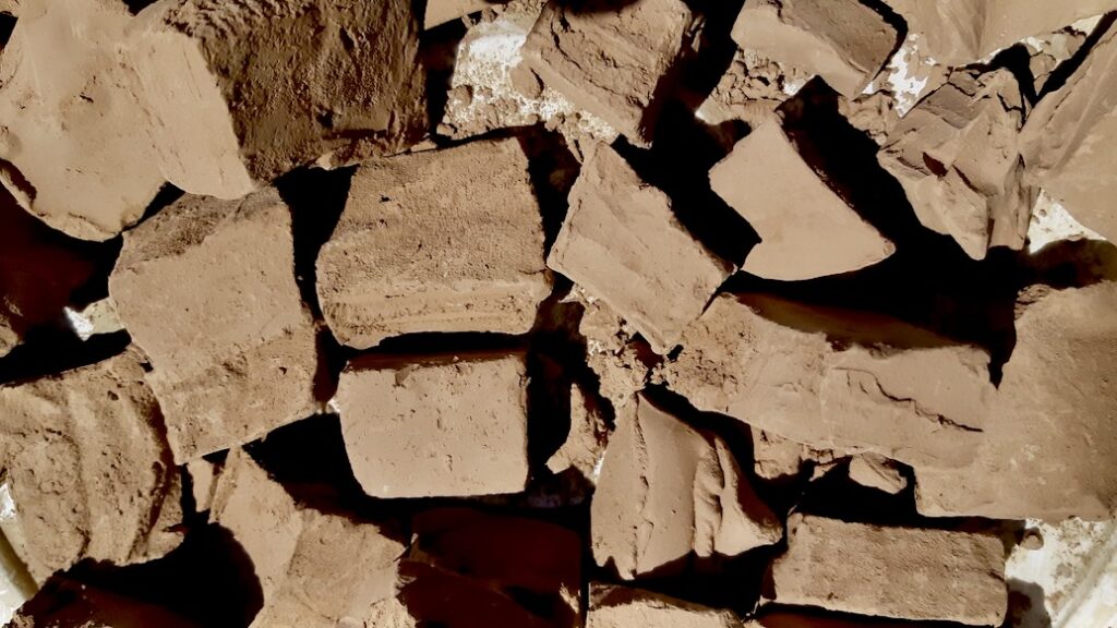 Red/Varved clay samples dry in the hot Northwestern Ontario summer sun. 