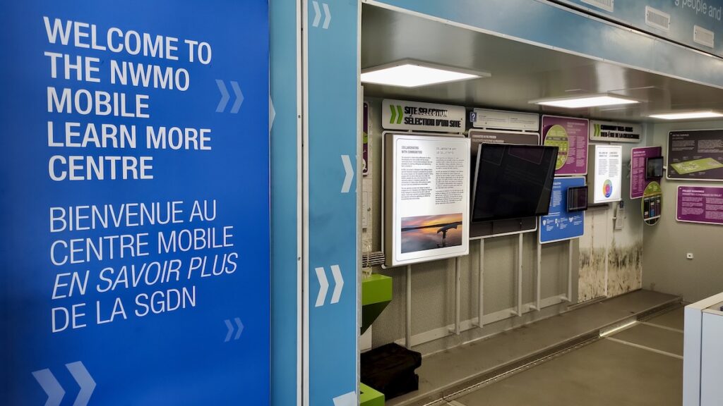 Inside the mobile unit, interactive touchscreens and bilingual displays greeted visitors looking to explore the details of the Deep Geological Repository project.
