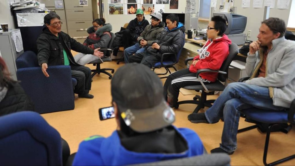 Dr. Zacharias Kunuk, O.C. mentors Inuit youth from the Arviat Film Society in storytelling and filmmaking.