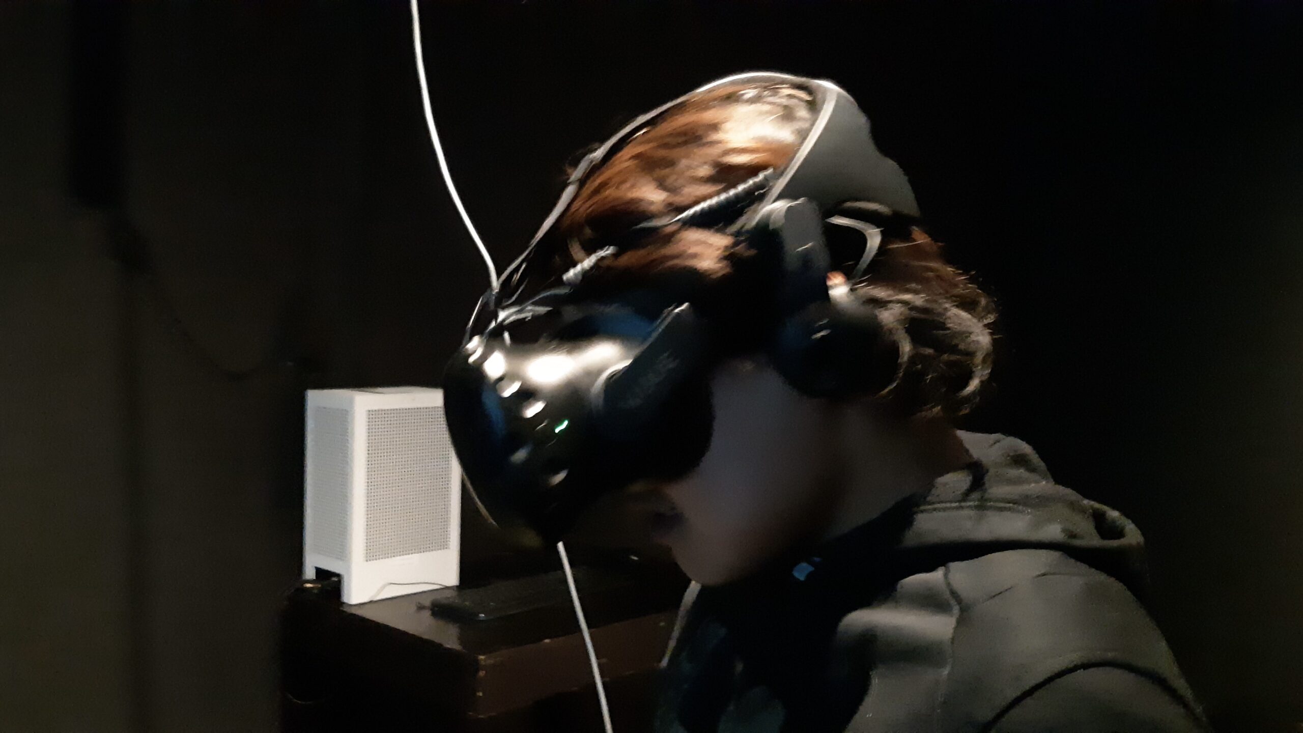 Emerging youth artist and musician Tony Eetak explores a VR installation in summer 2024 at the Urban Shaman Contemporary Art Gallery in Winnipeg, Manitoba.