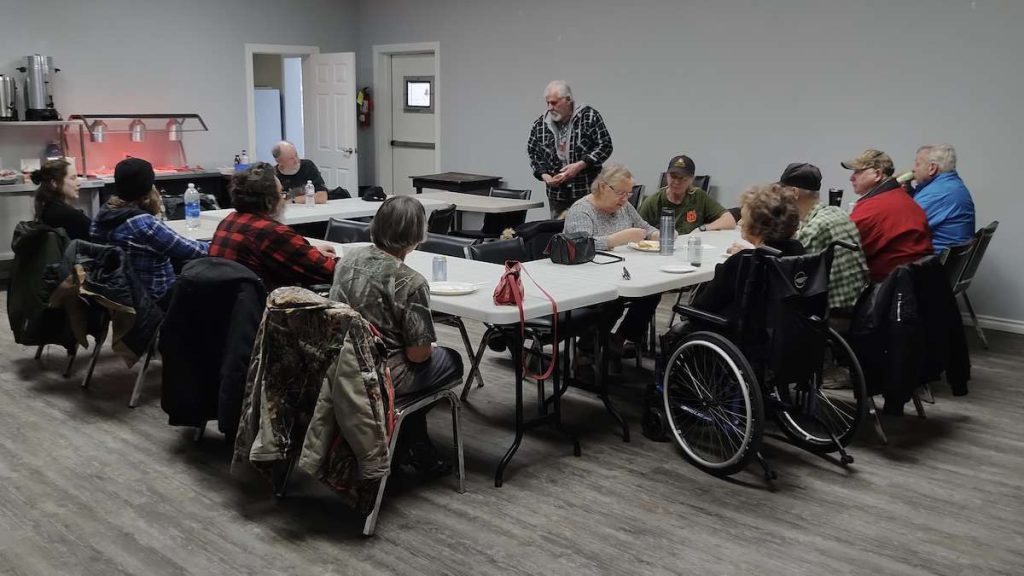 Community members share a meal and conversation at the monthly gathering in Dyment on March 9, 2025.