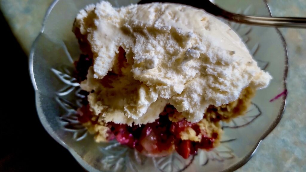 Experience pure dessert bliss with a warm serving of our Strawberry Rhubarb Crisp, crowned with a generous scoop of creamy vanilla ice cream. The cool, rich ice cream slowly melts into the warm, fruity filling and crisp oat topping, creating an incredible harmony of temperatures and textures. This classic pairing elevates the simple crisp into an extraordinary treat, perfect for satisfying any sweet craving. Discover how easy it is to make this delightful dessert that's truly a taste of home.