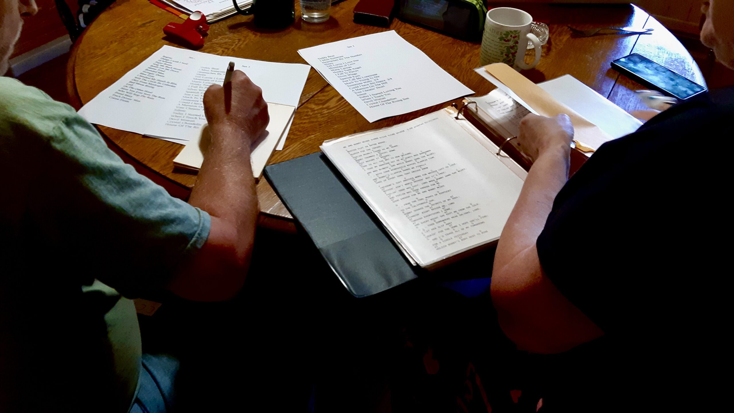 Set planning in full swing—artists collaborate over coffee and lyrics, shaping seven sets for Canada Day celebrations.