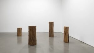 Transform your gallery with salvaged timber pedestals to create stunning, eco-friendly displays while saving your precious budget.