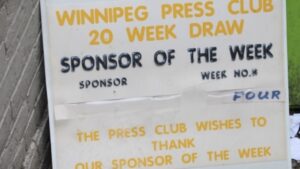 Tipped carelessly against a brick wall by a downtown dumpster, a discarded Winnipeg Press Club sign serves as a sobering monument to a forgotten era of local journalism.