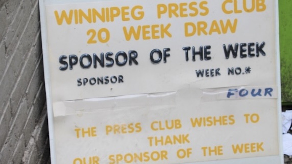 Tipped carelessly against a brick wall by a downtown dumpster, a discarded Winnipeg Press Club sign serves as a sobering monument to a forgotten era of local journalism.