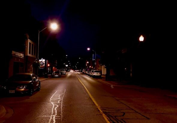 Windsor’s downtown streets transform after midnight, trading the daytime rush for an atmospheric, amber-lit canvas where late-night thinkers and night owls find space to connect.