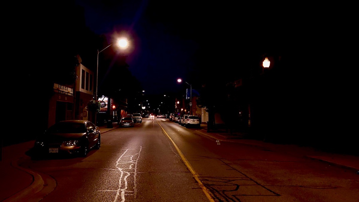 Windsor’s downtown streets transform after midnight, trading the daytime rush for an atmospheric, amber-lit canvas where late-night thinkers and night owls find space to connect.