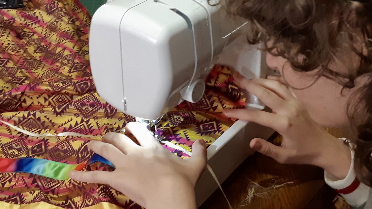 From fabric to finished garment, young participants gain sewing skills and confidence in a supportive studio space.
