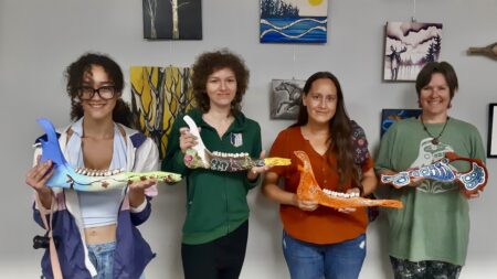 Artists with this year's summer arts incubator program show their newly painted creations.